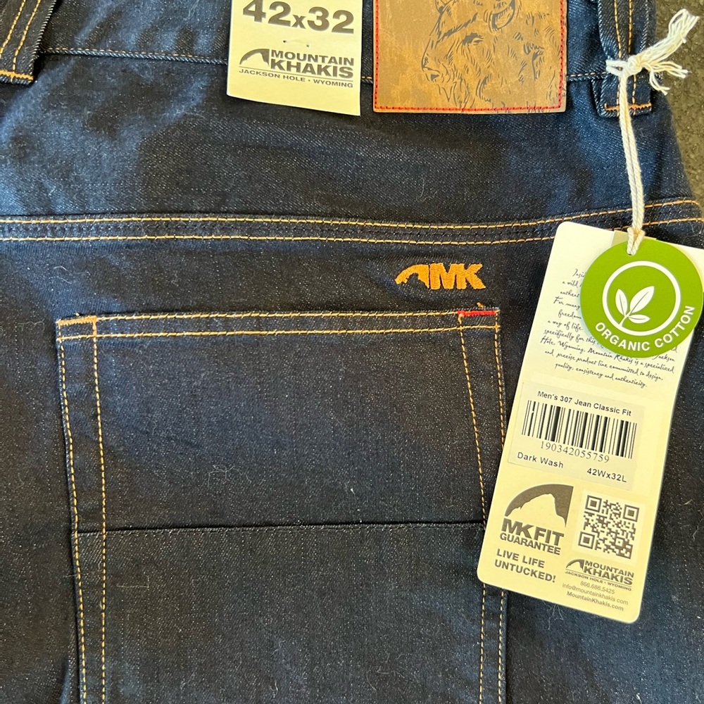 Mountain Khakis 42x32 never worn jeans with all tags. Classic fit. Dark blue